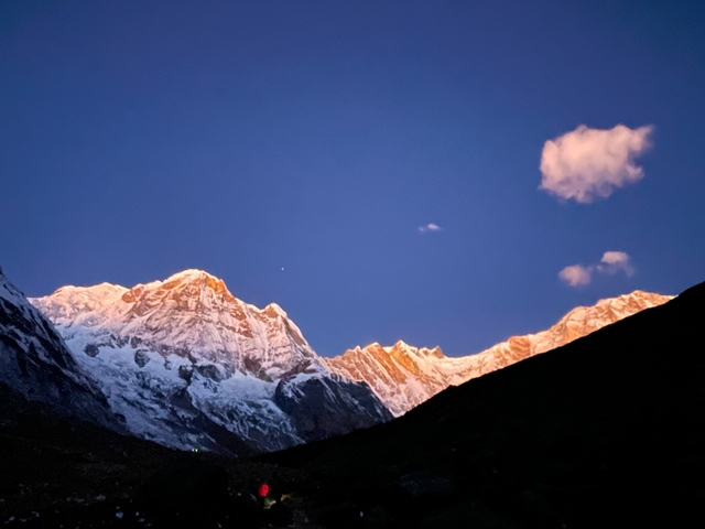       Snow-capped mountains at dusk.
  
