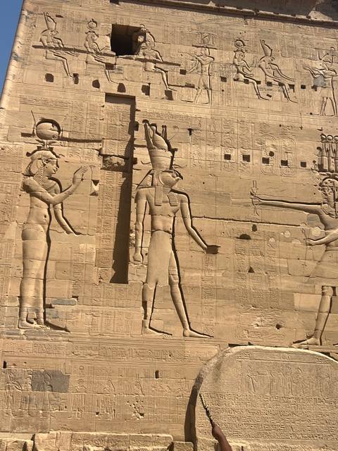       Ancient Egyptian stone carvings with hieroglyphs.
  