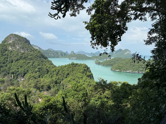 Scenic view of green islands and blue water.