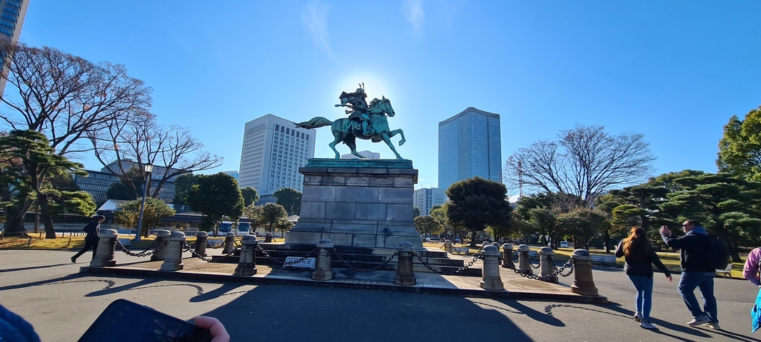       Equestrian statue with skyscrapers in the background.
  