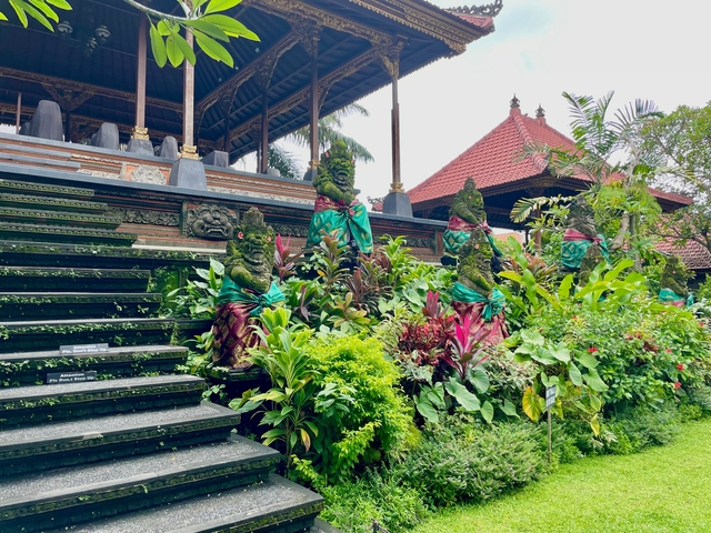 Vibrant garden stairs leading to a Balinese temple.