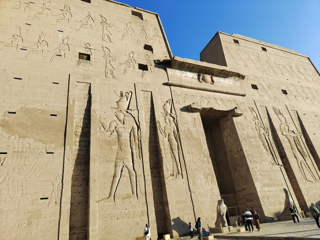       Close-up of an ancient Egyptian temple with carvings.
  