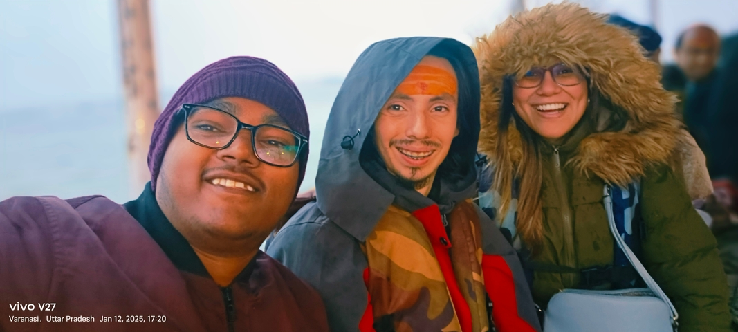       Three people in winter clothing smiling, with text overlay.
  