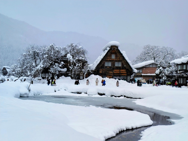 Traditional Japanese village covered in snow.
