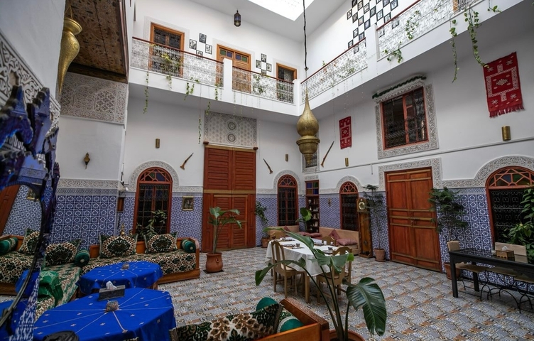       Interior courtyard of a Moroccan riad with traditional decor.
  