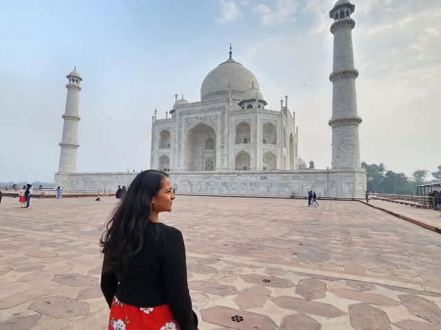 Person looking at the Taj Mahal.