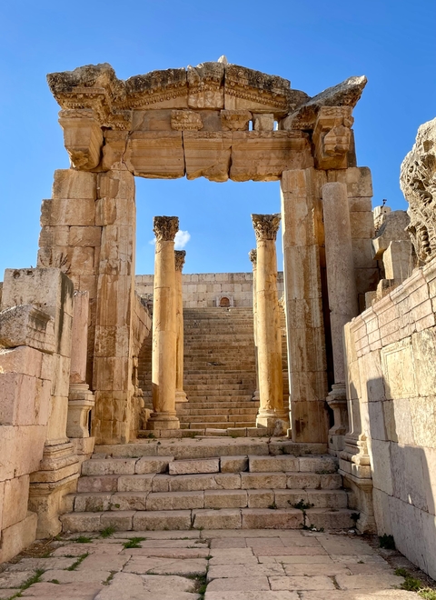       Ancient stone architecture with steps leading up.
  