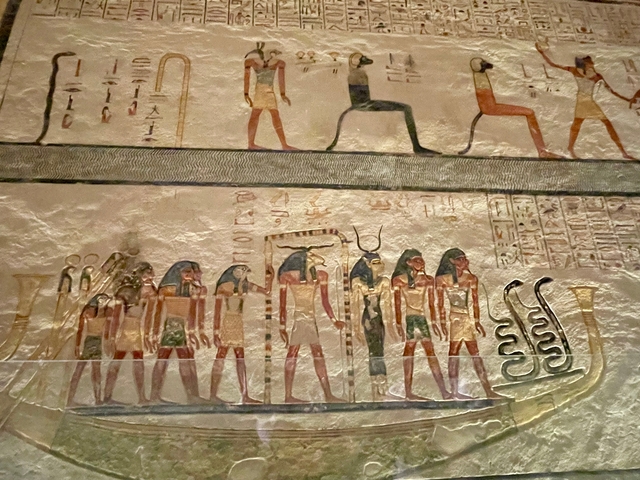       Ancient Egyptian wall carvings with detailed hieroglyphs.
  