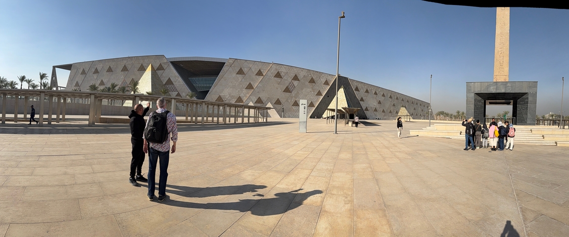 Exterior of a modern museum with visitors outside.