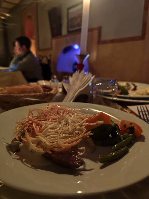       Close-up of a dish with vegetables and bread.
  