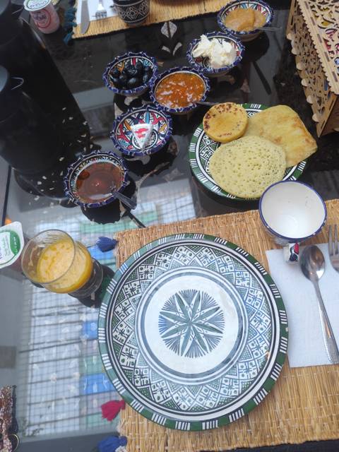 Traditional Moroccan breakfast with bread and juice.