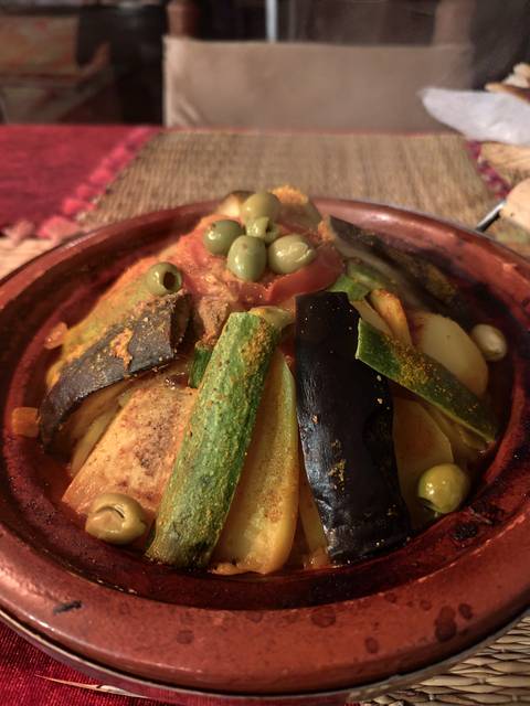      Colourful Tagine dish with vegetables and spices.
  