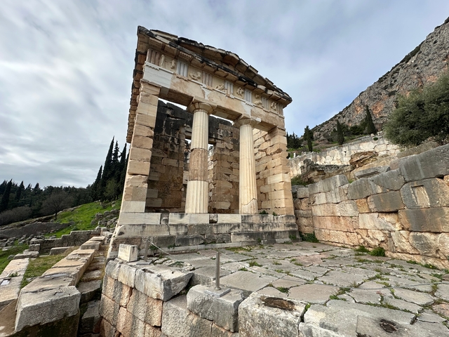       Ancient Greek temple with columns.
  