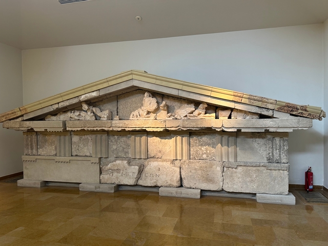 Ancient stone artifact displayed in a museum.