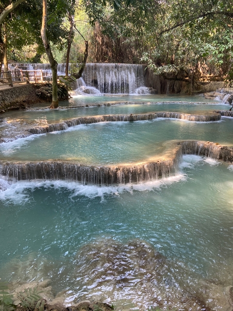 Multilevel waterfalls with turquoise water cascading down.
