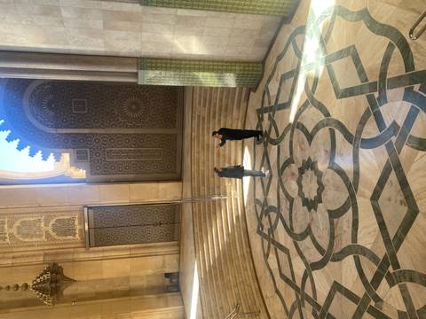       Ornate architecture with people in the background.
  