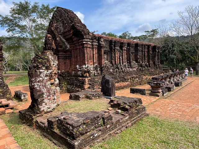       Historic ruins with people exploring.
  