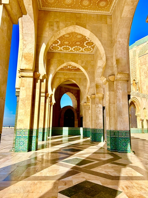 Intricate arches and columns of a Moroccan mosque.