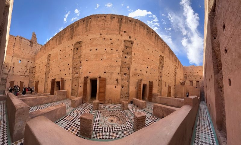 Ancient Moroccan ruin with intricate wall designs.