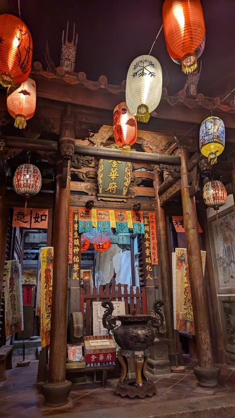       Traditional temple interior with decorations.
  