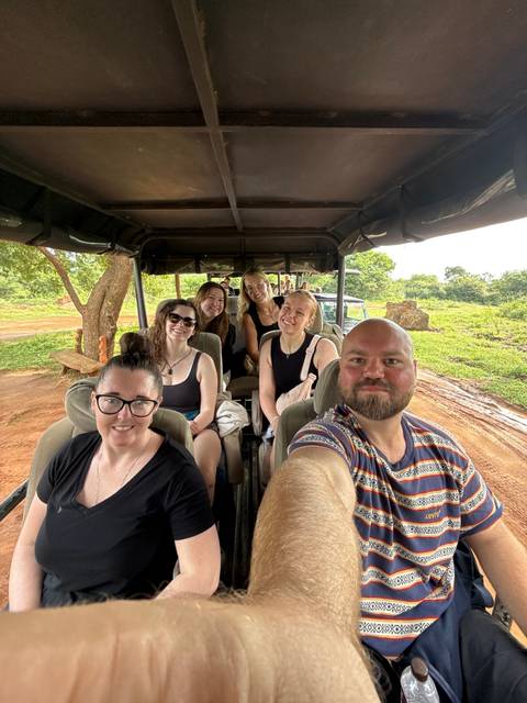 People in a safari vehicle enjoying a wildlife tour.