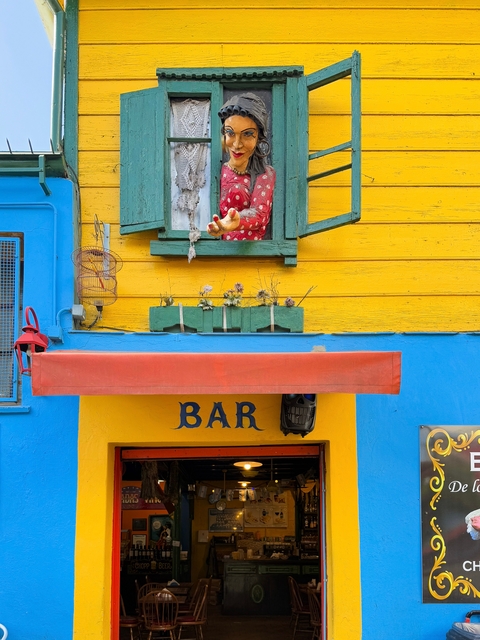 Quirky facade with colorful bar signage.