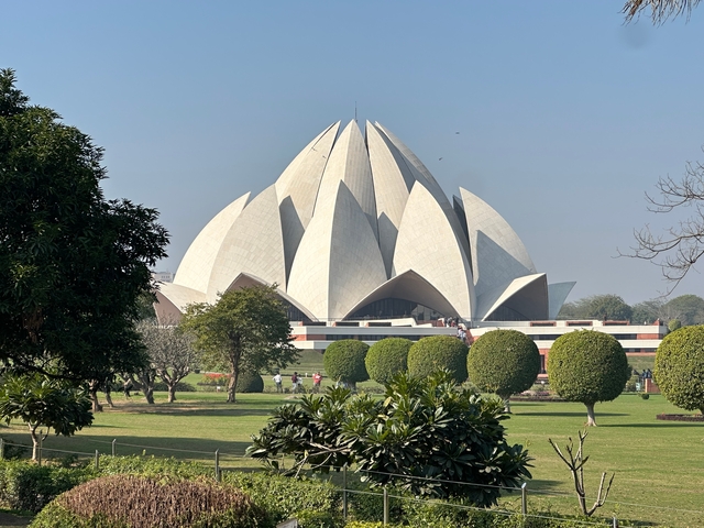 Lotus Temple with gardens in front.