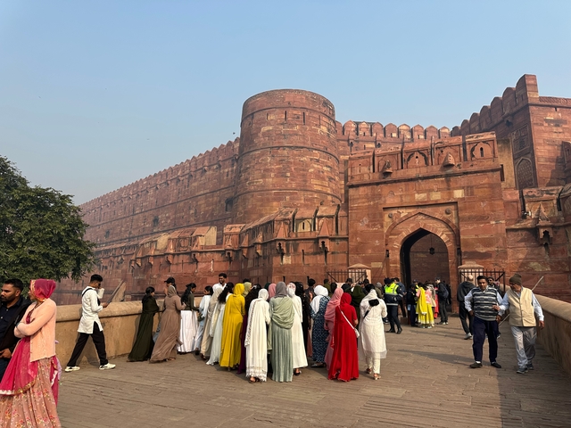 Agra Fort with people gathered outside the entrance.