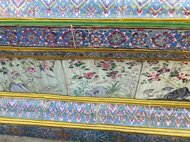 Close-up of colorful floral tiles.