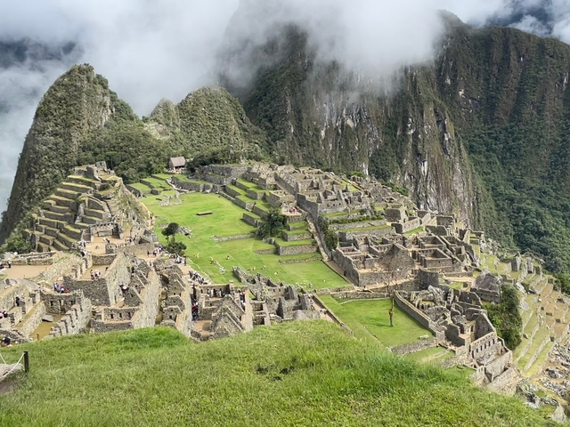       The ancient ruins of Machu Picchu surrounded by misty mountains.
  