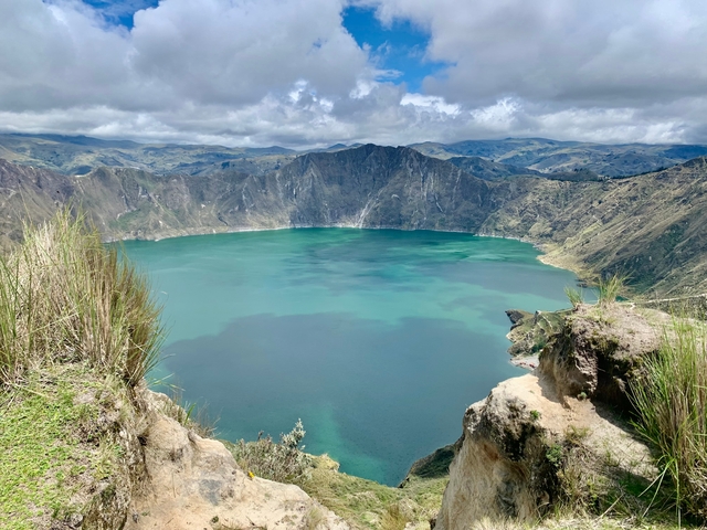 A scenic view of a large crater lake.