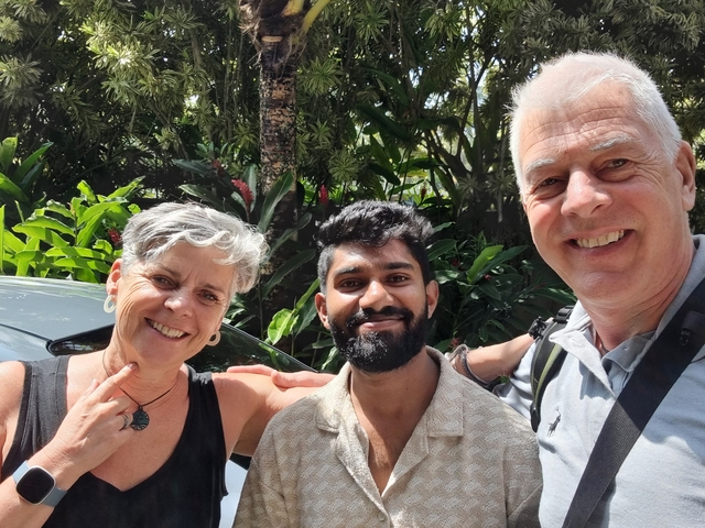 Group of people in a garden area.