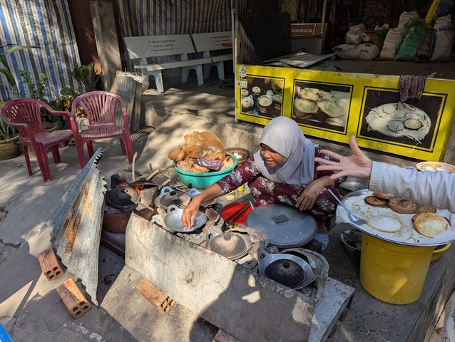       Local vendor selling traditional food items.
  