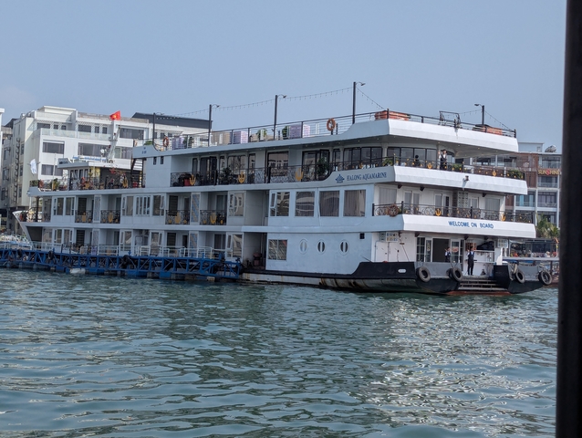      Docked cruise ship on a calm water body.
  