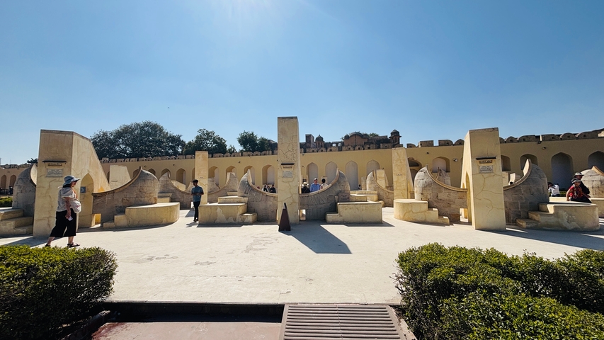       Observatory instruments in Jaipur under a clear blue sky.
  