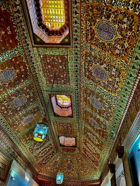 Intricately decorated ceiling with colorful patterns.