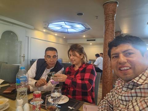 Group of people inside a restaurant or cafe.