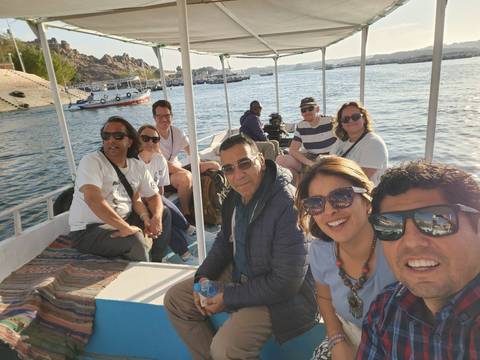 Tourists on a small boat enjoying a river trip.