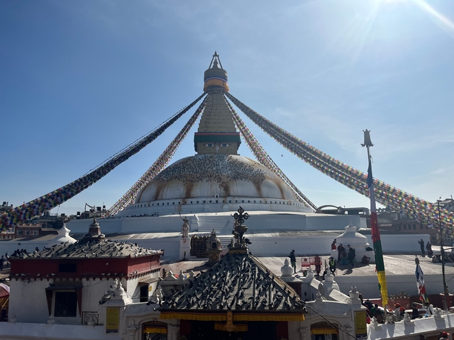 Large stupa with prayer flags, known as Boudhanath Stupa.