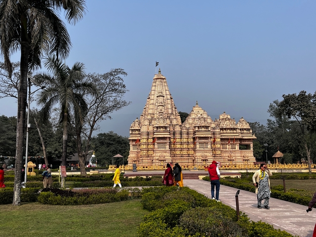 Temple complex with visitors walking around.