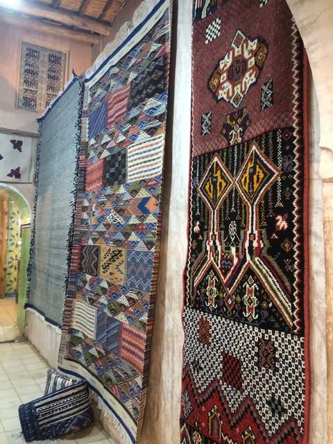       Colorful rugs displayed in an indoor setting.
  