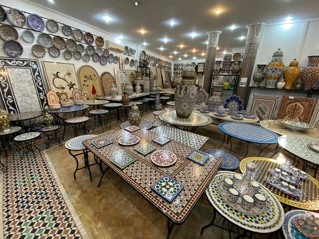 Inside a shop displaying traditional Moroccan ceramics and tiles.