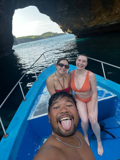 People on a boat enjoying their outing.
