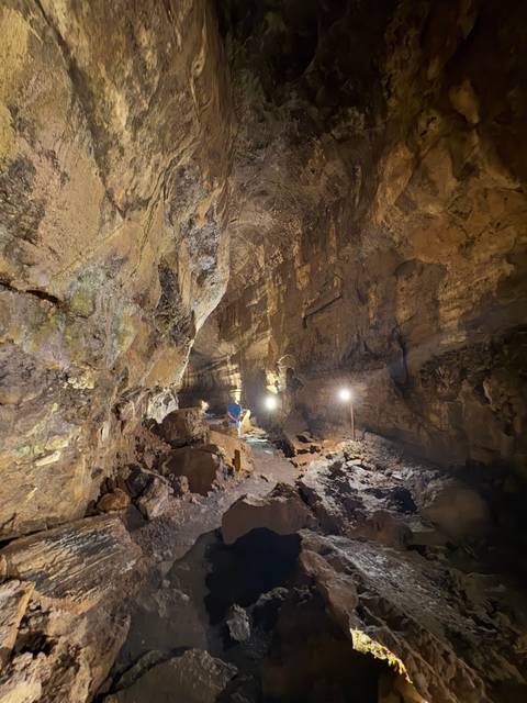       Exploration of a textured, illuminated cave.
  