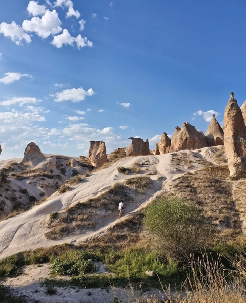 Unique rock formations under a blue sky.