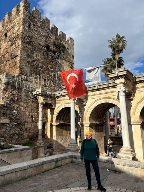       Hadrian's Gate with Turkish flag and decorative lights.
  