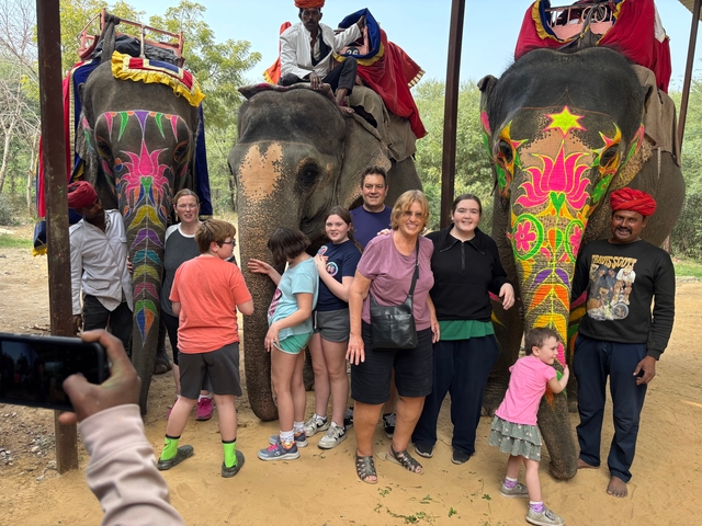 Family group with painted elephants.