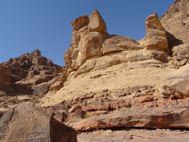       Desert rocks under clear blue sky
  