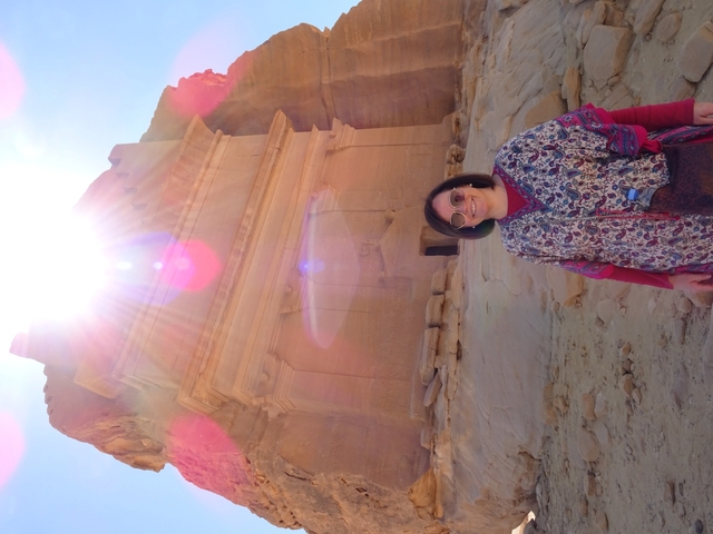       Sunlit ancient tomb with person
  