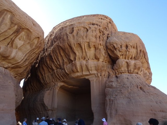       Close-up of rock formations with unique eroded patterns.
  